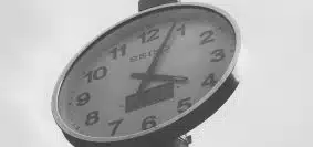 grayscale photo of wall clock displaying 4:04